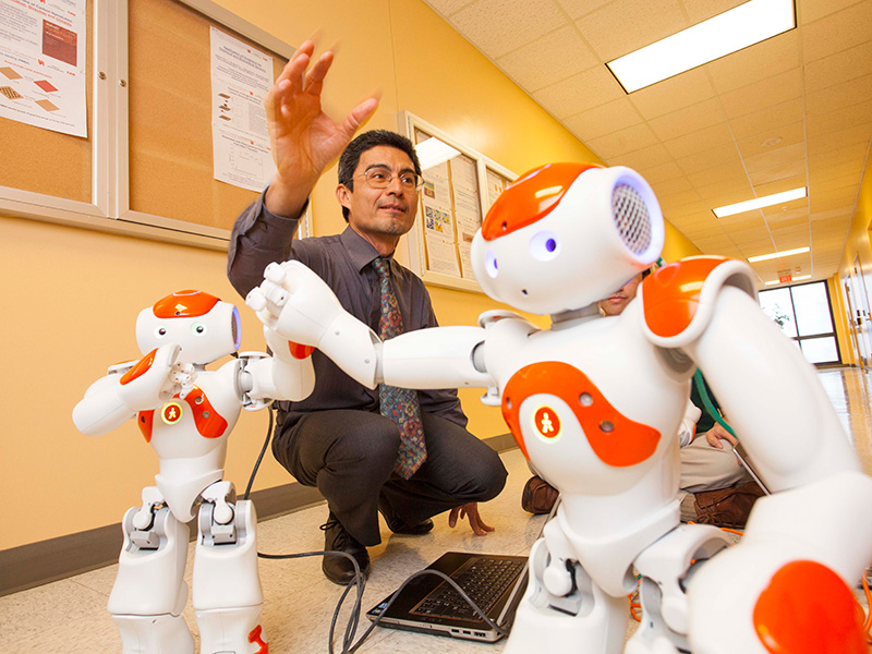 Professor Jose “Pepe” Luis Contreras-Vidal uses his NAO robots to inspire young students to pursue careers in STEM.