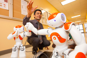 Professor Jose “Pepe” Luis Contreras-Vidal uses his NAO robots to inspire young students to pursue careers in STEM.